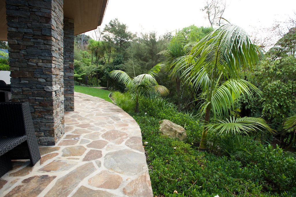 view of paving and palms
